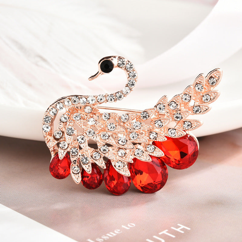 Stylish floral design brooch displayed on a cloth