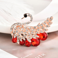 Stylish floral design brooch displayed on a cloth