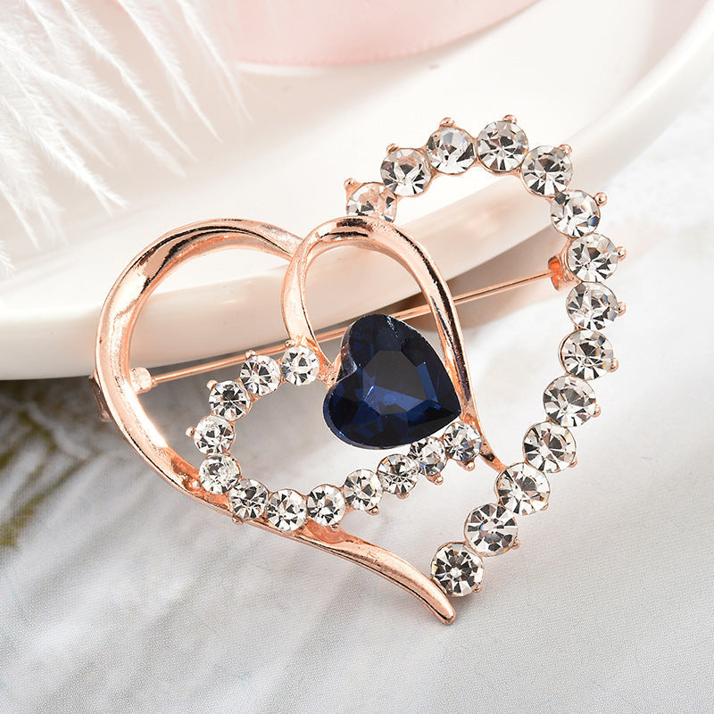 Trendy heart-shaped brooch showcased elegantly