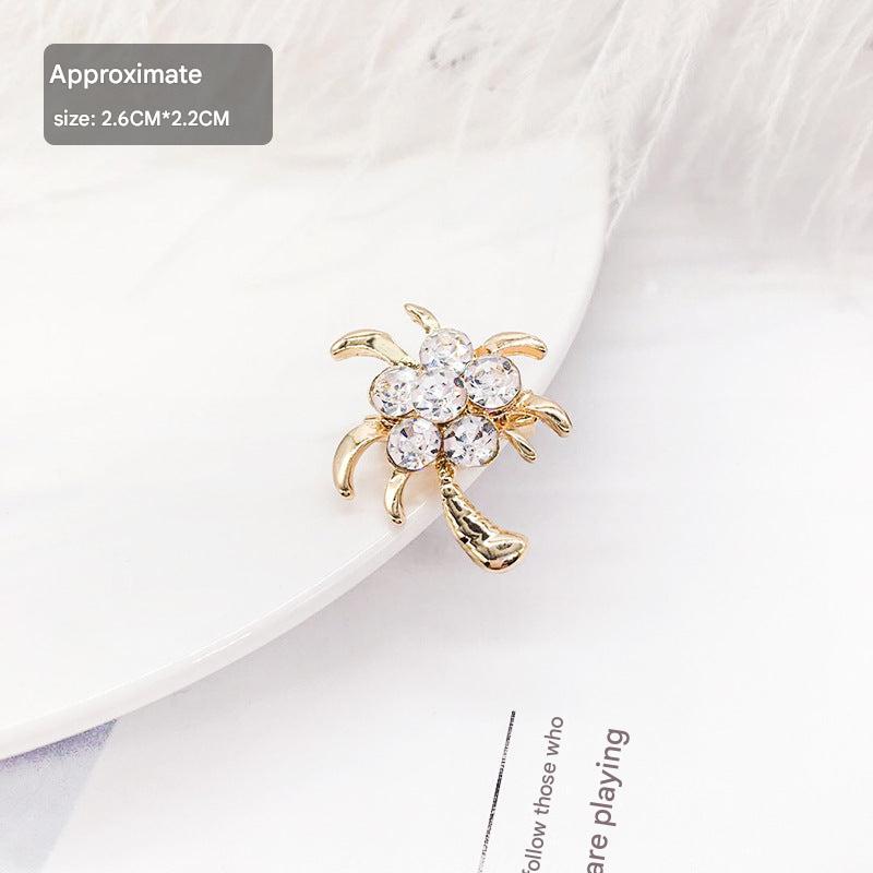 Stylish floral design brooch displayed on a cloth