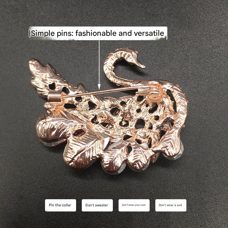 Heart-shaped brooch shining with colorful rhinestones