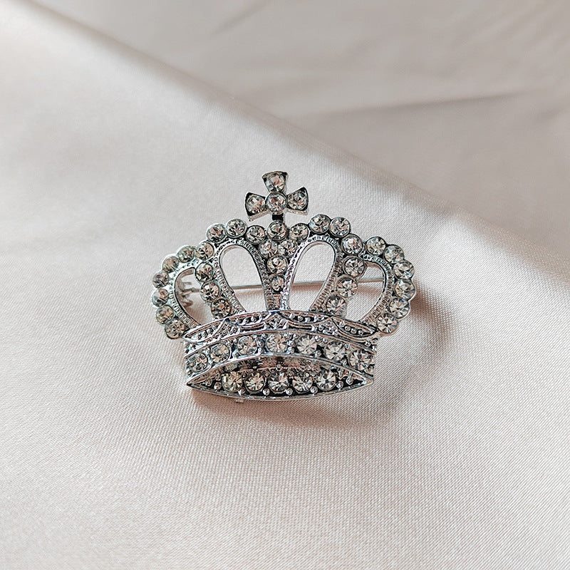 Elegant silver brooch with rhinestones