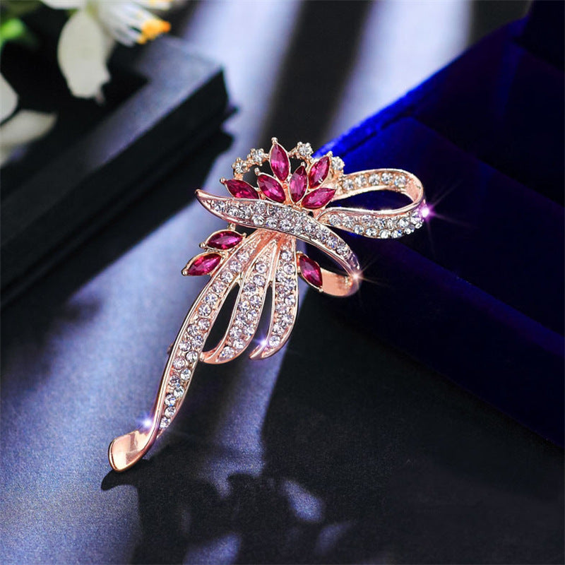 Elegant floral brooch with cat's eye stone