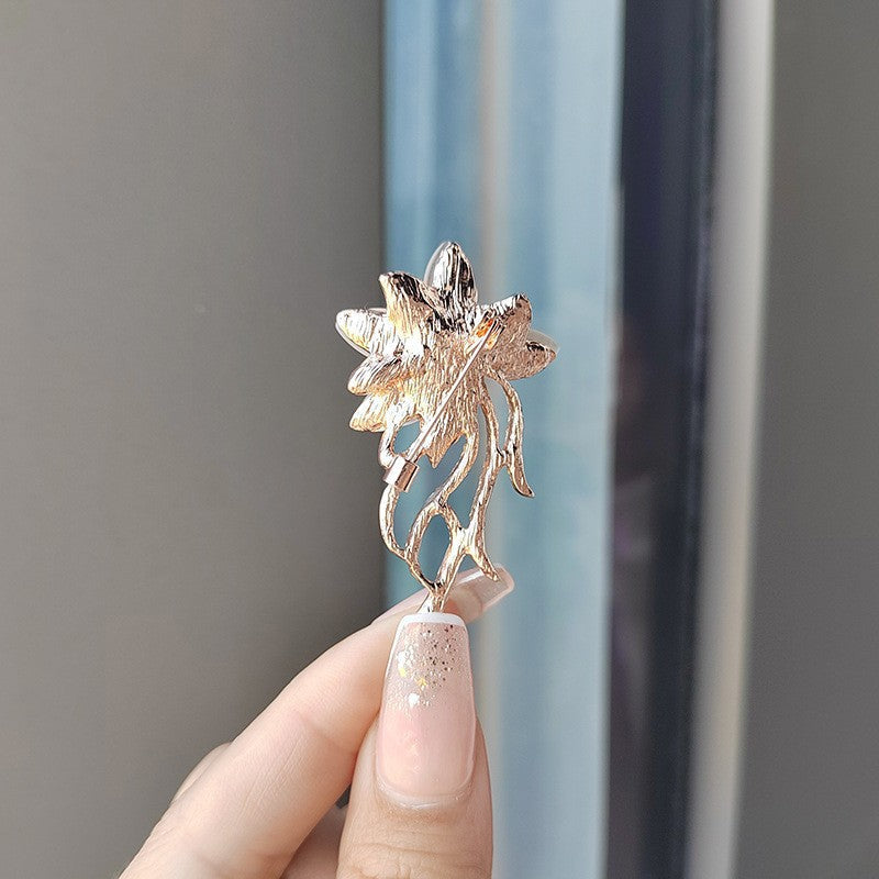 Stylish floral brooch on a scarf