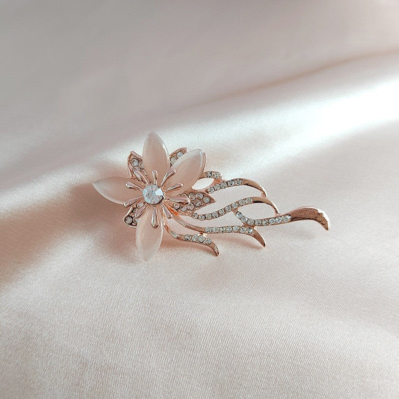 Floral brooch pin showcased on fabric