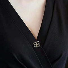 Clover leaf brooch shining in the light