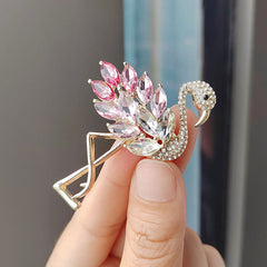 Flamingo crystal brooch worn as a fashion accessory