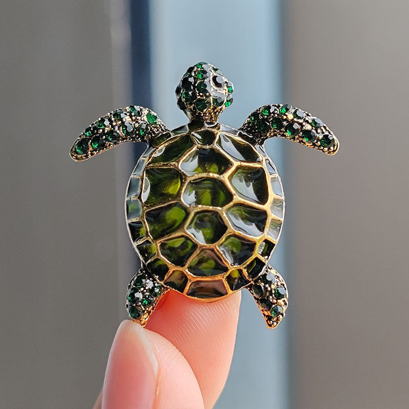 Pink turtle brooch as a fashion accessory