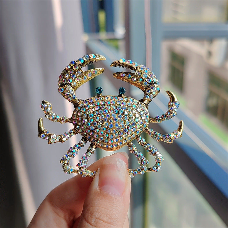 Stylish Alloy Crab Brooch displayed with other accessories