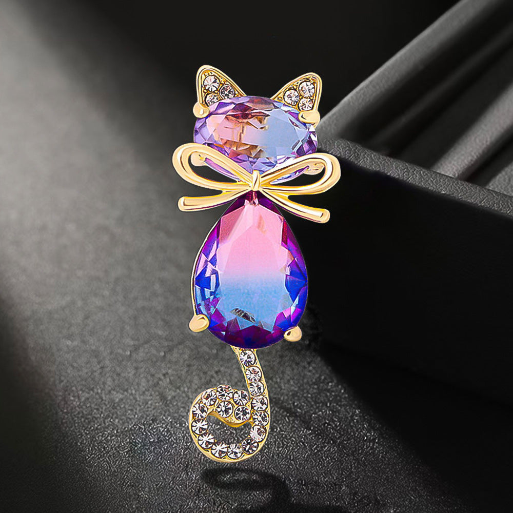 Gradient colour cat brooch displayed elegantly
