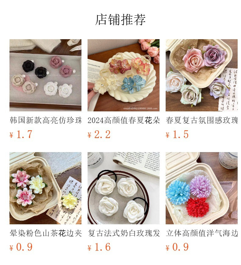 Cute floral hair clips on a wooden table