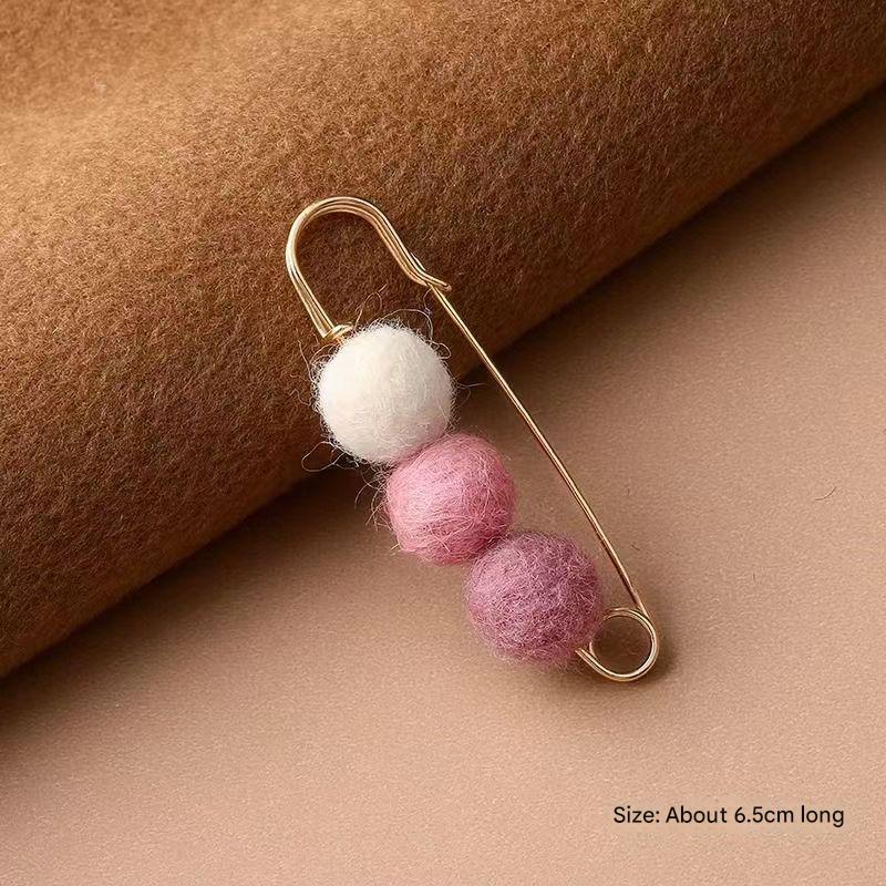 Soft plush texture of the cardigan brooch